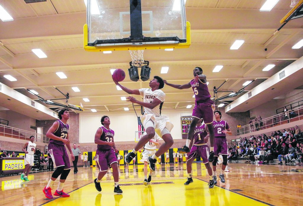 Marcos de Niza's Zurell Livingston (4) makes a shot during a basketball game against Desert Ridge in Tempe on Friday, December 11. Padres defeat Jaguars 61 to 56.  Wrangler News photo by Ana Ramirez. More photos can be found online at www.wranglernews.com.
