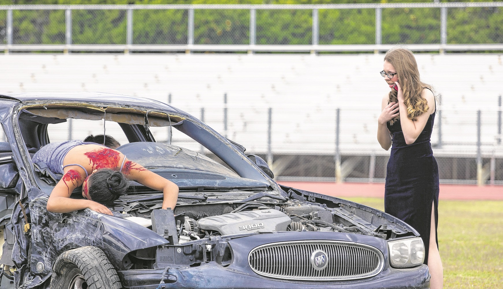 Young actors portrayed the tragic consequences of drinking and driving during a multi-agency exercise at Marcos de Niza High School. (Wrangler News photo by Alex J. Walker)