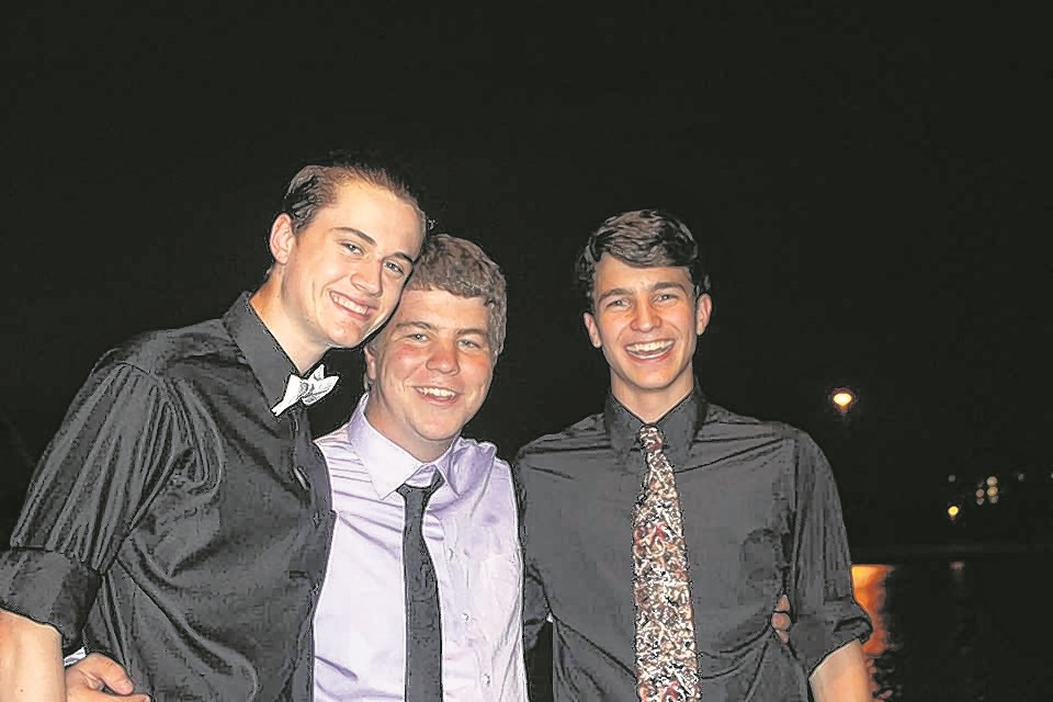 Taylor Snow, center, shares a smile with hosts Luke Fleming, left, and David Ewen. 