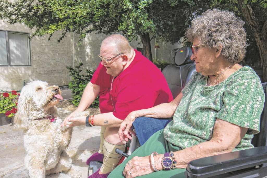 Lucy the therapy dog treats patients with a double dose of love and affection. (Wrangler News photo by Alex J. Walker)