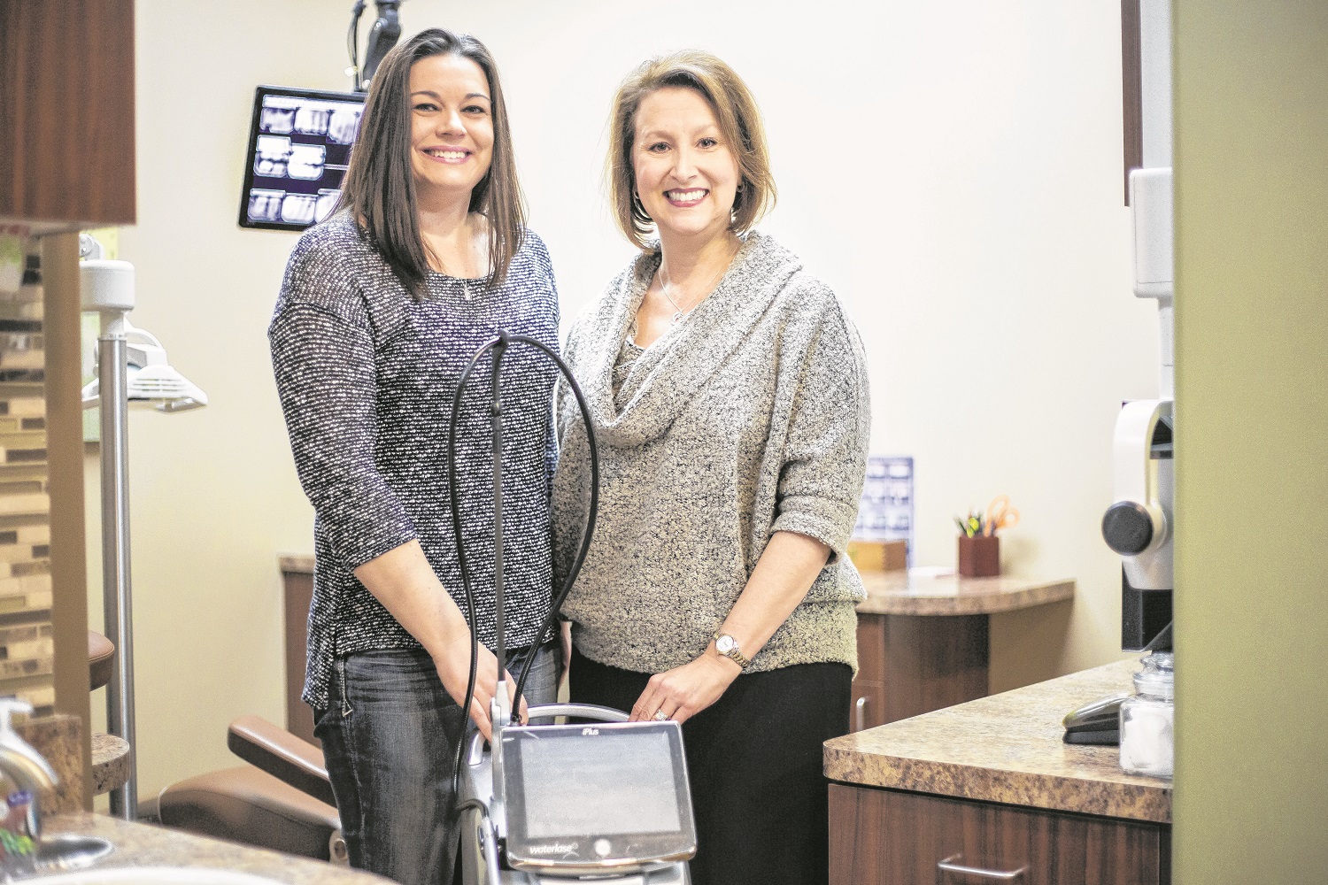 Drs. Humber and Tracy: Celebrating 10 years in dental partnership.  Wrangler News photo by Billy Hardiman. 
