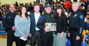 Celebrants included, from left, Tempe Assistant Chief of Police Angel Carbajal; Taylor Bingold; Blaze Baggs (Larry's son); Officer Larry Baggs; Wendy Baggs; and Tempe Chief of Police Tom Ryff. — Photo courtesy Tempe Elementary Schools' Public Information Office